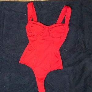 Red ASTR bodysuit. Size XS